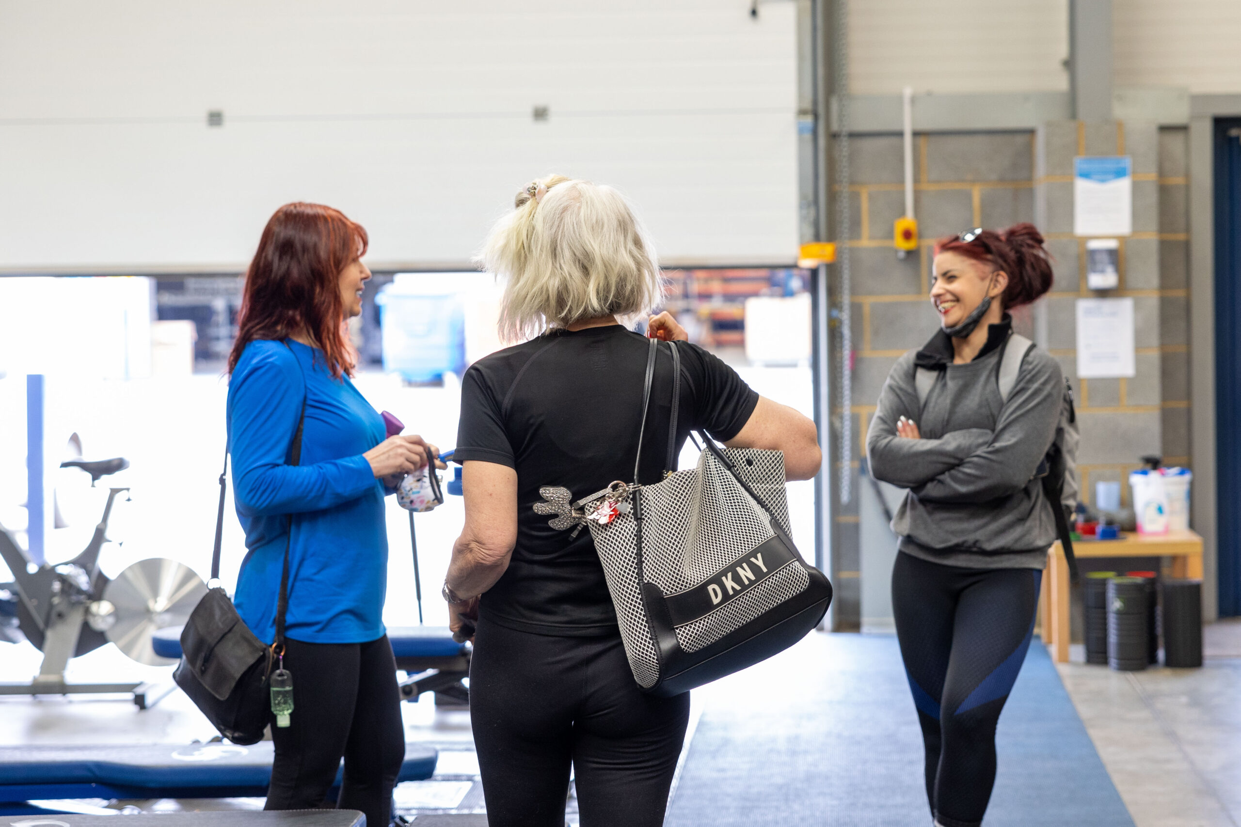 Group chatting at the gym